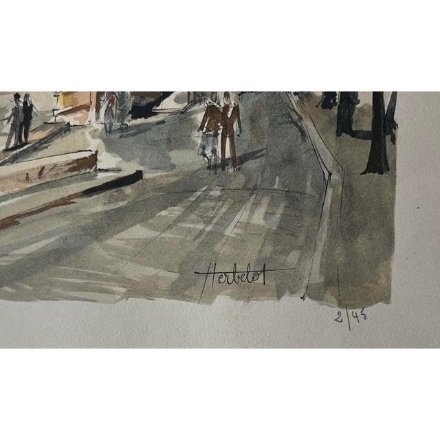 Framed, color lithographic reproduction of watercolor of Paris riverfront scene, signed Herbelot and numbered 2/45. Franz...