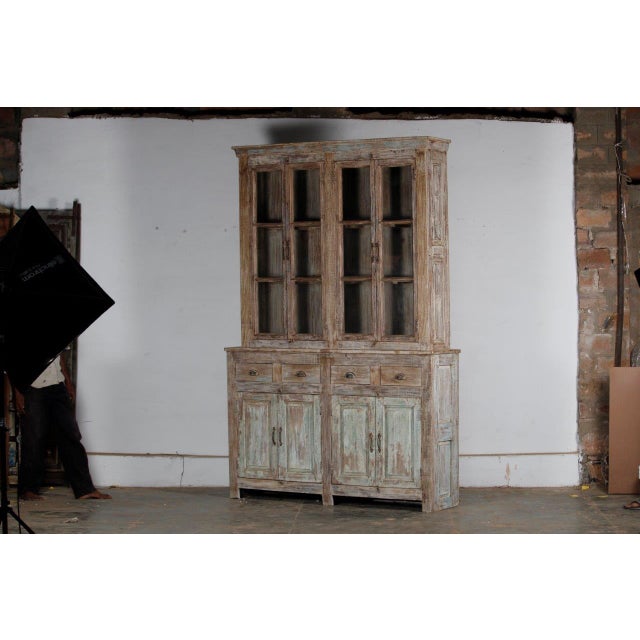 Indian Bleached Teakwood 4-door Large Cabinet or Bookcase, with remnants of an old paint finish on the door panels....