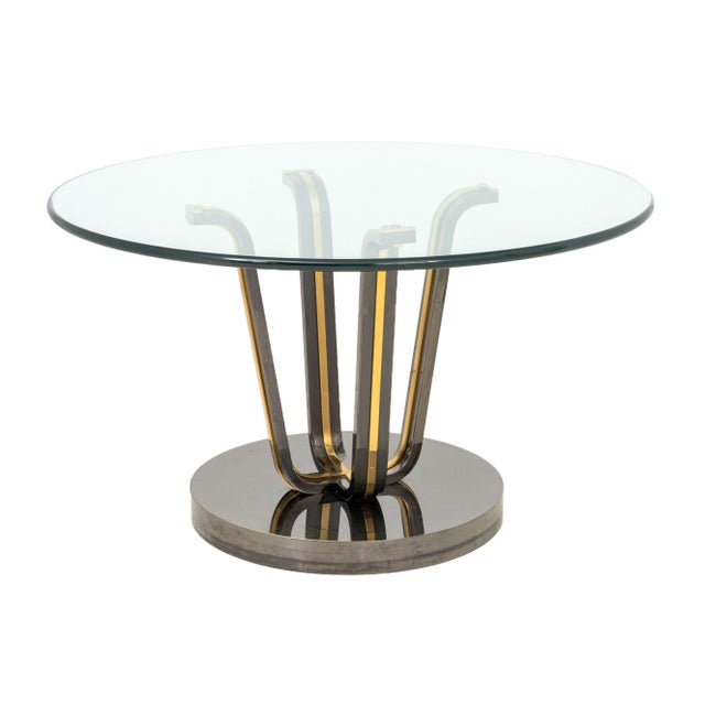 Renato Zevi Attributed Glass and Chrome Circular Table, the circular glass top above four chrome and brass supports on...