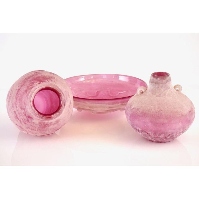 This unique set of three vessels was designed by Livio Seguso for Bisazza, representing the "Scavo" aesthetic of the 1980s...