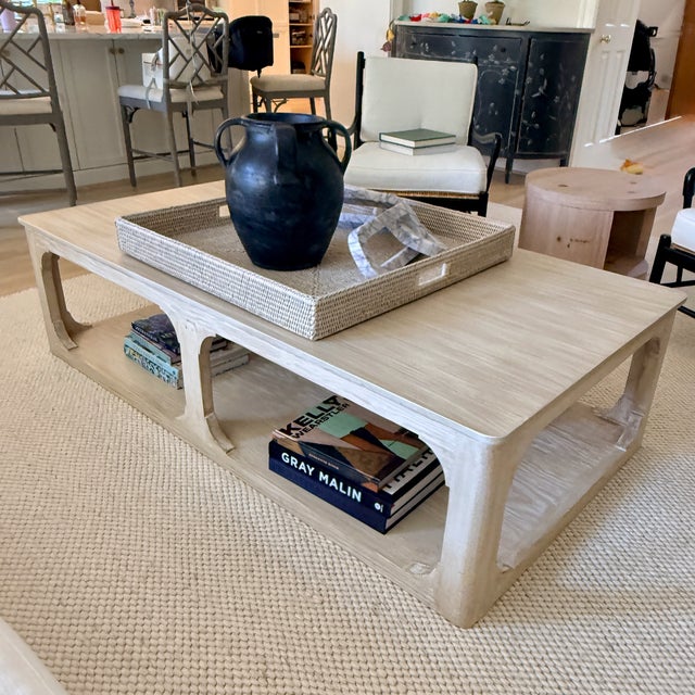 Ming Arched Rectangular Coffee Table A blonde wood large coffee table with very subtle Ming details, Two tiers of storage...