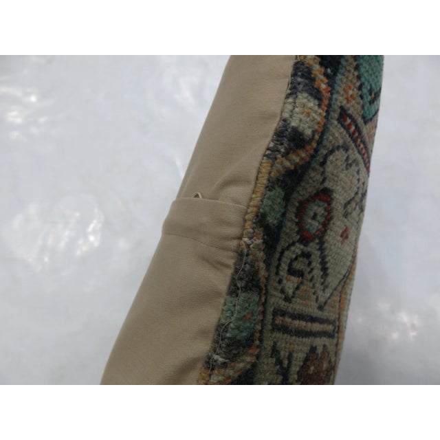 Pillow made from a vintage Turkish rug with cotton back. Zipper closure and foam insert provided. 1'3''x2'4''