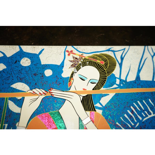 striking Asian-inspired decorative artwork featuring an elegant woman playing a flute, surrounded by a dramatic cobalt...