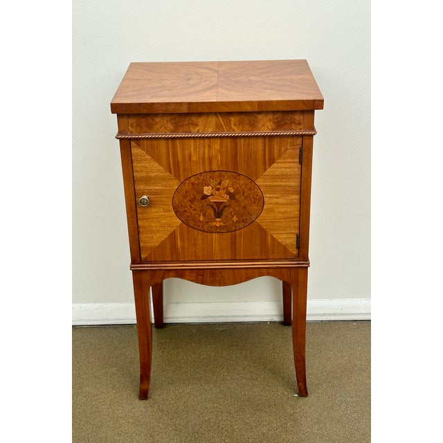 Beautifully made satinwood and cherry side / drink table with book matched veneers on the top and doors decorated with...