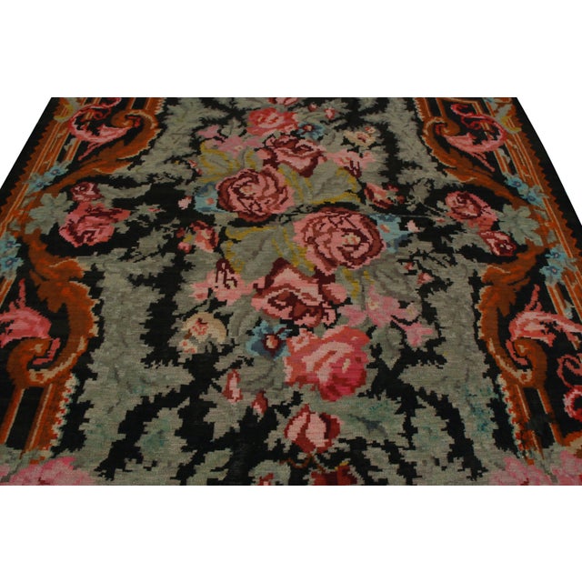 A Turkish approach to a style that originated in Romania, this vintage Bessarabian Kilim rug was handmade in Turkey with a...