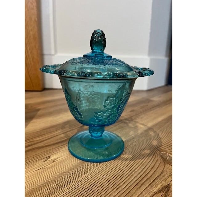 This item is a vintage Indiana Glass lidded candy dish featuring the Harvest Grape pattern in a vibrant blue color. t...
