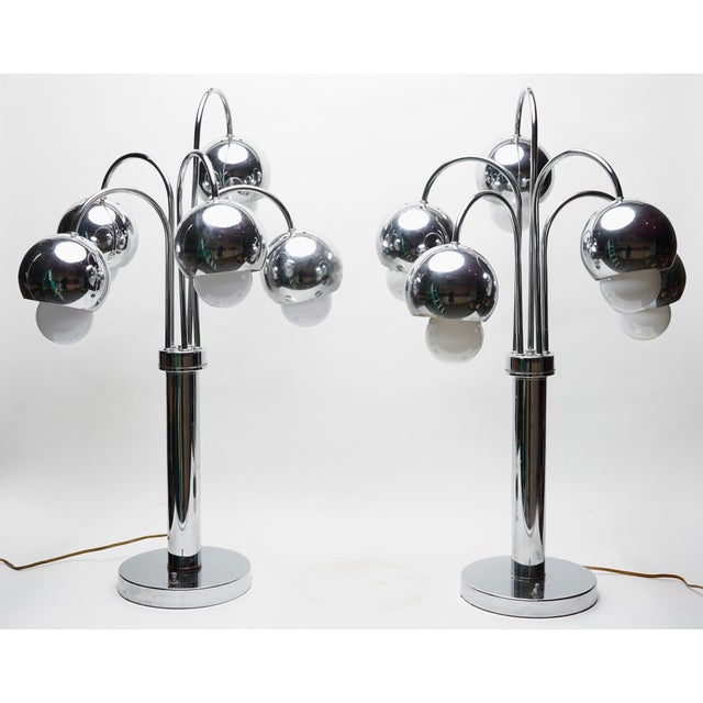 These are 1970s Robert Sonneman chrome "waterfall" table lamps featuring multiple sphere shades.Designer: Robert...