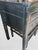 A black rustic 5 drawer ming leg console table. The table features a black rustic finish with 5 drawers and metal...