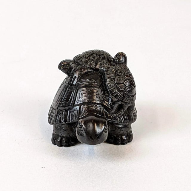 Miniature hand carved mother turtle made of hardwood. Turtles are a symbol of longevity