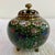 A beautifully detailed antique Japanese cloisonné censor (koro) featuring a vibrant phoenix bird amid a lush floral ground...