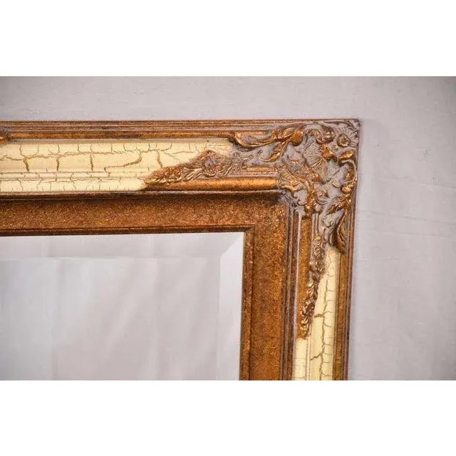 Beveled mirror with ornate gold and off-white crackle finish frame - 21.75x27.5