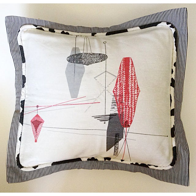 Mid-century pillow sham with period lighting fixture designs. Black and white piping frames the front with sham edging in...