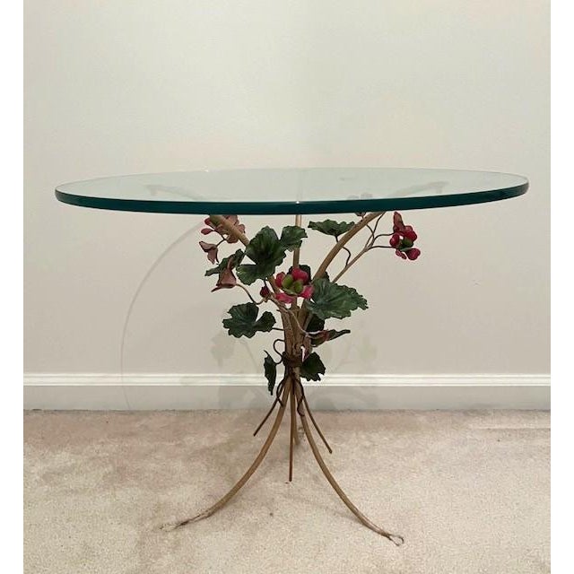 Mid 20th century Italian tole side table with attached round glass top. The tri footed base is creamy white and has red...