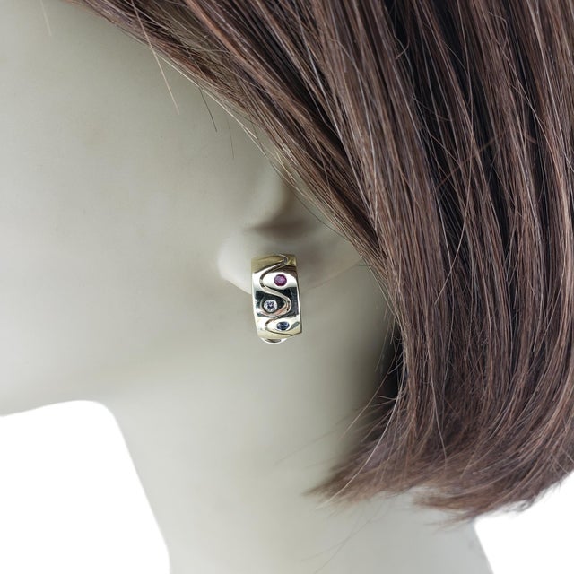 14K Yellow Gold Sapphire, Ruby and Diamond Earrings JAGi Certified These lovely earrings each feature one round brilliant...