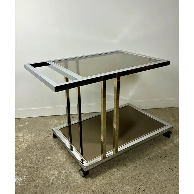 Large service / Belgian roller table Chrome / Dewulf Vintage selection 70's in silver and golden brass. 2 glass trays, a...
