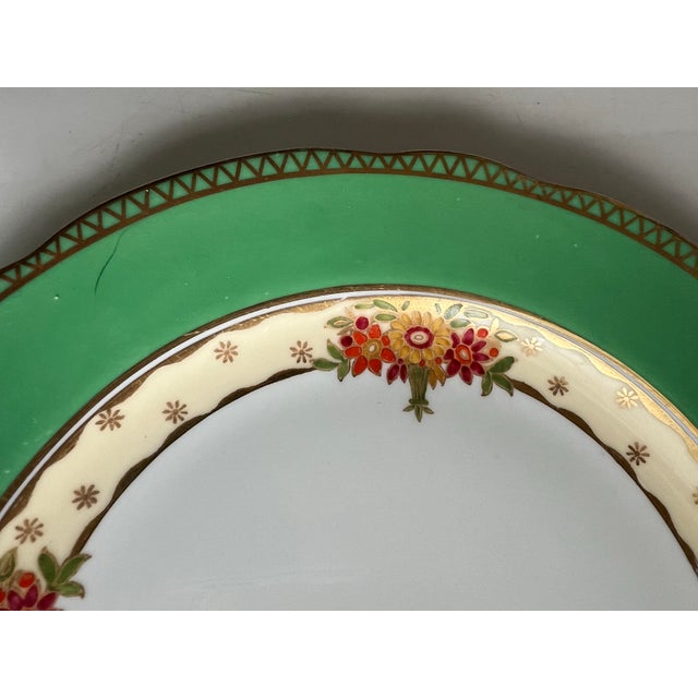 Mid Century Bone China plate marked Aynsley England. Bright green boarder with gold accents & scallops edges. Footed...