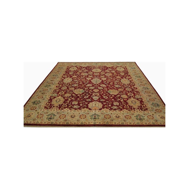This unique 12x15 Handwoven Indian Agra Area Rug will add a touch of elegance to your home. Its floral pattern has roots...