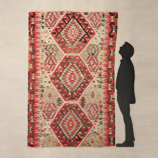 Kilim rug in cotton, fine knot and hand made. This piece is attributed to the mentioned designer/maker. It has no...