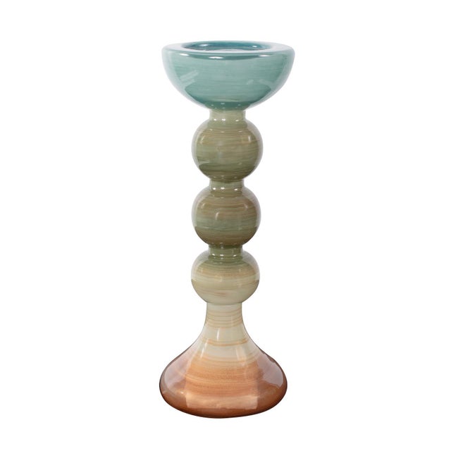 A vibrant assortment available in multiple sizes and shapes. The candle holders showcase a stunning ombre effect,...