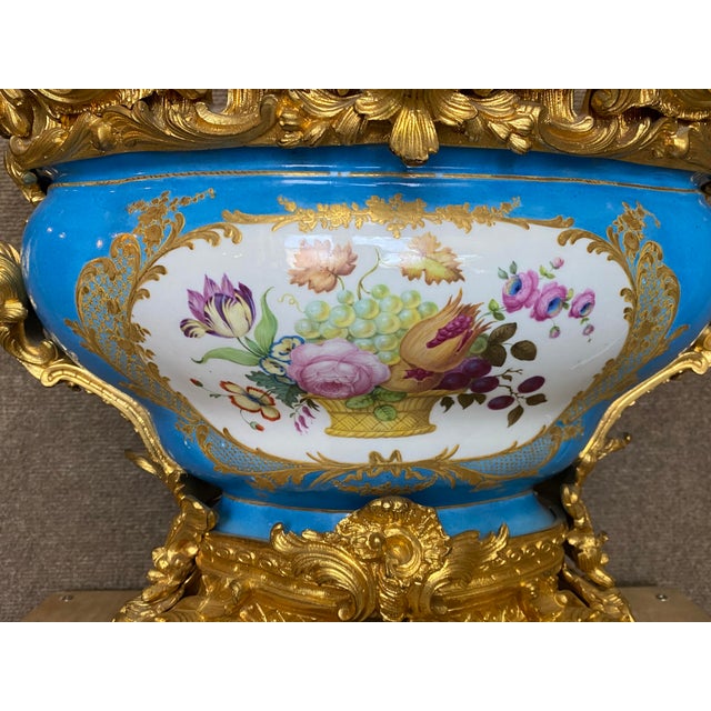 An exceptional late 19th-century French porcelain jardinière or centerpiece, richly decorated in the Louis XV / Rococo...
