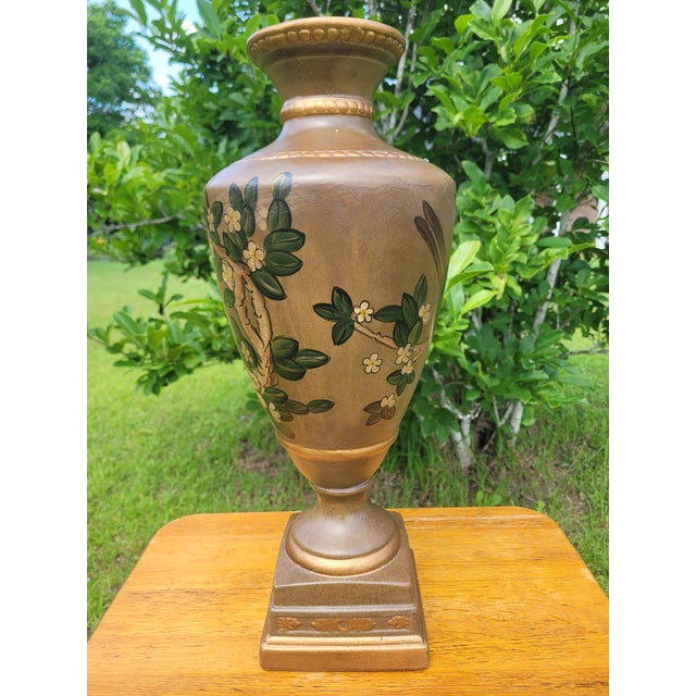 Add a touch of timeless Chinoiserie elegance to your mantle or entry table with this stately hand-painted trophy vase....