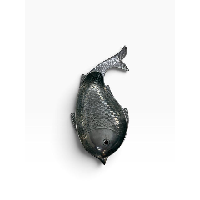 An authentic first-decade production vintage sand-cast aluminum fish-shaped serving dish designed by mid-century metalware...
