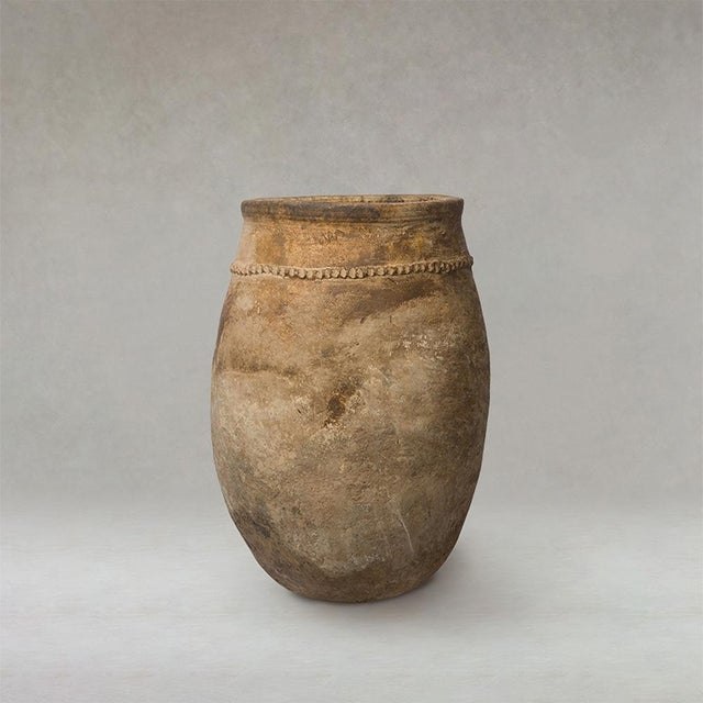 Antique Berber unglazed clay storage Vessel from Morocco, dating from the early 20th century, with a softly rounded form...