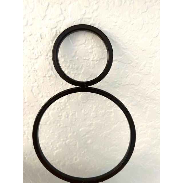 Stylish pair of contemporary brown wrought iron beveled mirror candle sconces. Each holds one pillar candle. Hardware on...