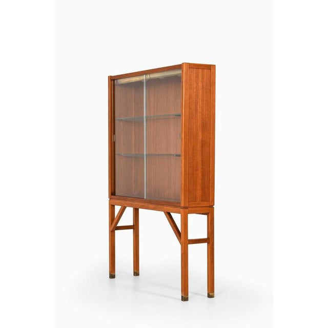 This rare cabinet, designed by carl-axel acking and produced by bodafors in sweden during the 1950s, is a sophisticated...