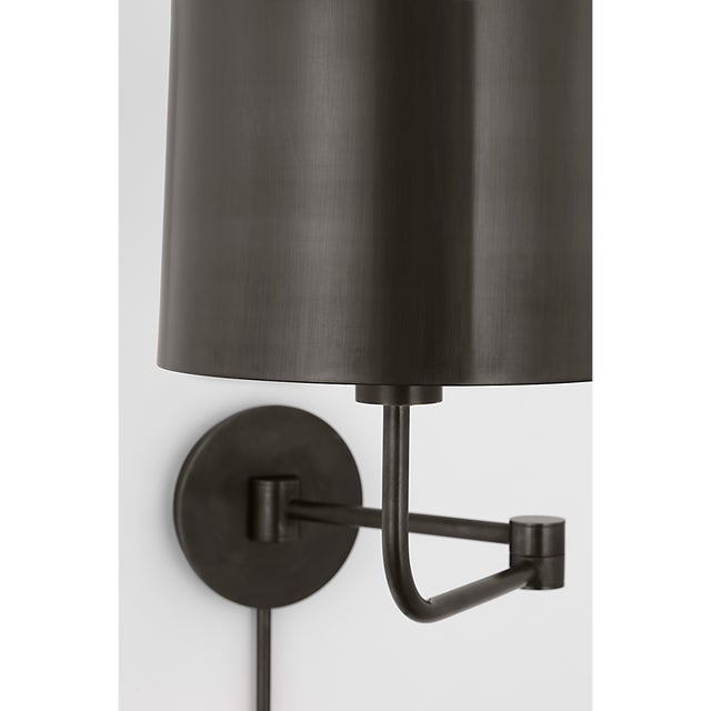 Go Lightly Swing Arm Wall Light in Bronze with Bronze Shade Designer: Barbara Barry Finish: Bronze Height: 15.75" Width:...