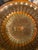 Vintage earthenware slip glazed decorative plate made in Horeza, Romania in the iconic peacock pattern. This piece is...