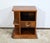 This small bedside table, in solid and plated walnut, opens with a drawer, with a triple movement facade, with chrome...