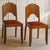 This pair of chairs originated around 1930, in the transitional period between late Art Deco design and traditional...