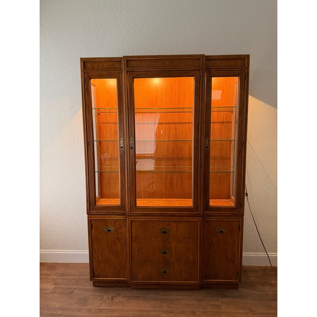 Late 1980s Drexel "Passage" display hutch with three adjustable plate groove glass shelves, dual lower cabinets, three...