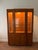 Late 1980s Drexel "Passage" display hutch with three adjustable plate groove glass shelves, dual lower cabinets, three...