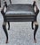 Early 20th Century Carved Wood Accent piano or vanity Storage Bench with vinyl seat..Measures 21" in width, 15.5" in depth...
