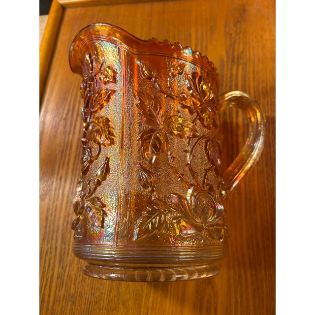 Vintage Imperial Glass "Lustre Rose" carnival glass pitcher in a marigold color. This pattern was first produced by...