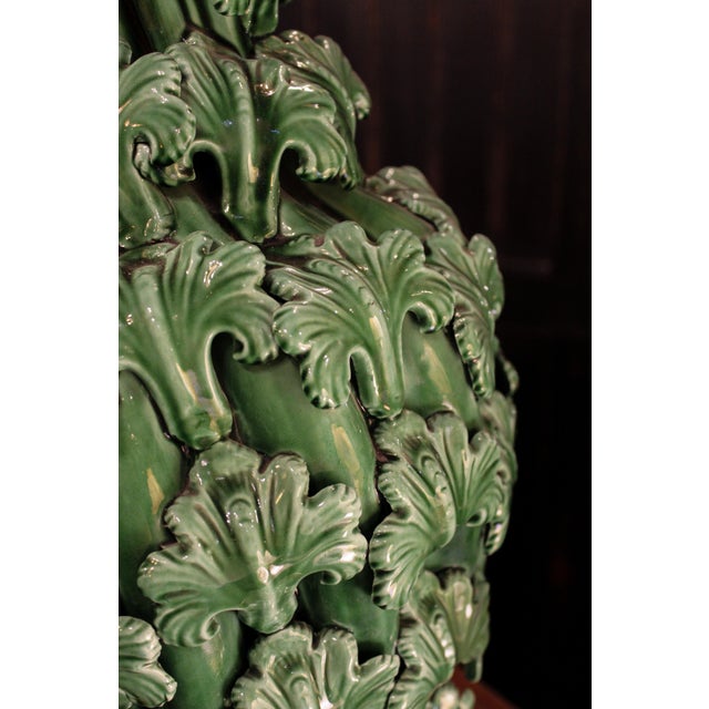 A stunning ceramic vase from Manises, whose luminous green glaze creates a striking effect. Completely covered with a...