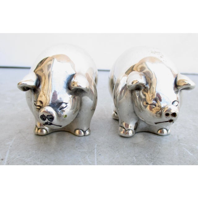Salt Pepper set in Sterling Silver. Charming little fat pork'ers. Fitted with cork stoppers and high shine silver...