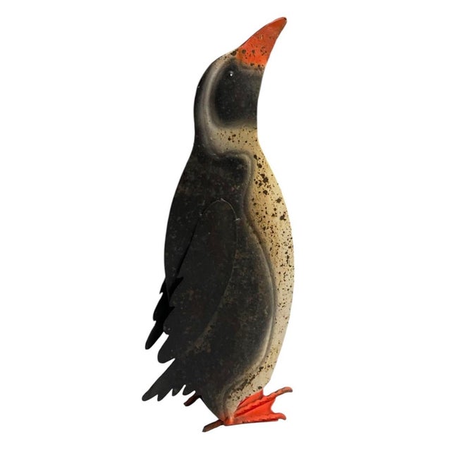 This charming vintage penguin sculpture captures the playful essence of Mid-Century Modern design with a touch of stylized...