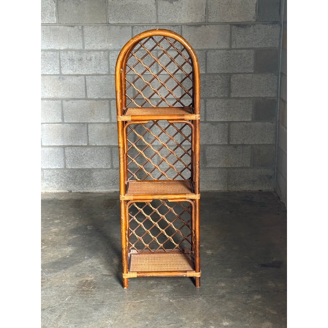 Gorgeous bamboo framed shelf with cane shelves and cane wrapped corners. Nice details and a great size. Could be used in a...