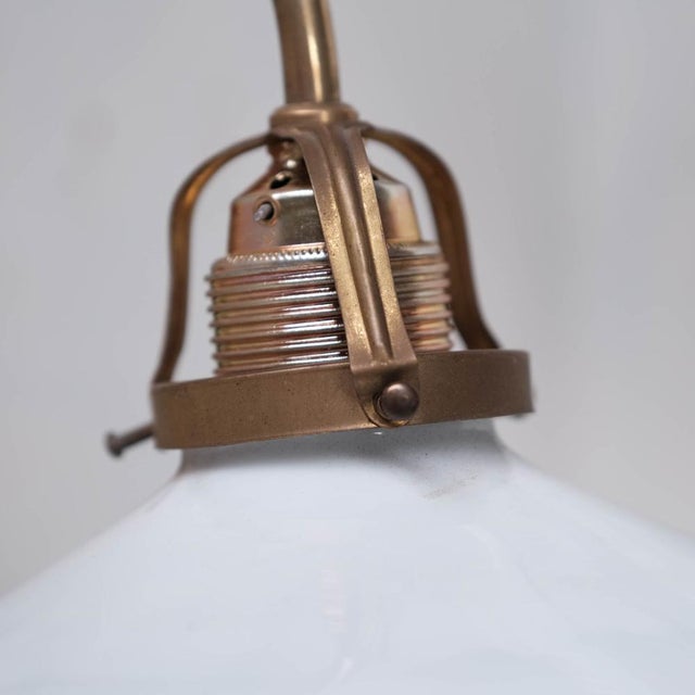 Opaline, Brass and Reflective Glass Wall Light, in Good conditions. Designed 1950 to 1959 UK Plug (up to 250V).The wiring...