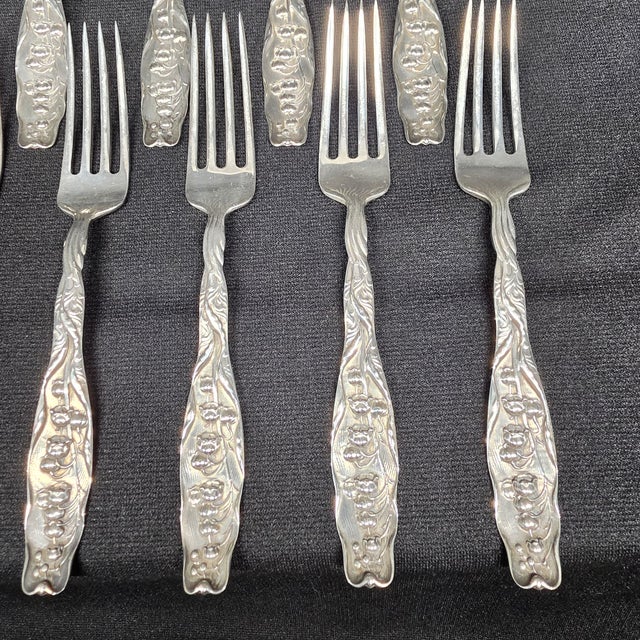 This Art Nouveau antique 1885 "Lily of the Valley" sterling silver luncheon fork set by Whiting Manufacturing Company is a...