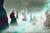 The artwork "Q'sh II" presents an ethereal landscape where enigmatic formations rise amidst a misty atmosphere, evoking a...