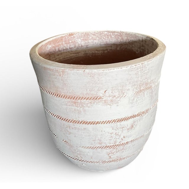 Bring a touch of Mediterranean soul to your home with this vintage-inspired terracotta planter, sourced from Tunisia....