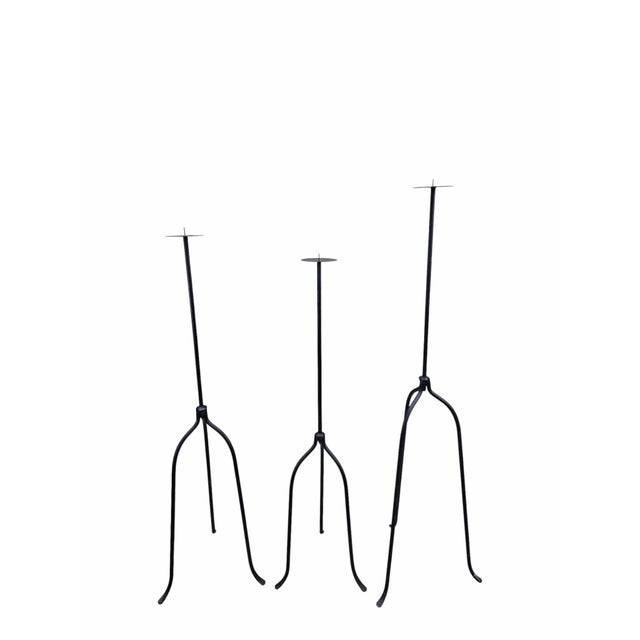 Vintage Black Iron Nail-Top Candle Stands – Set of 3 Vintage black iron candle stands featuring nail-style pointed tops....