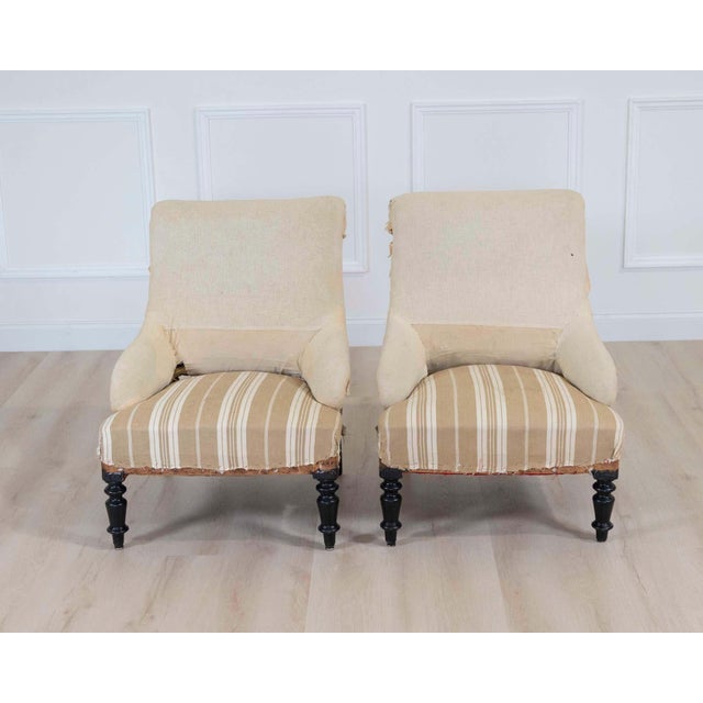 Elegant pair of 19th century French scroll back chairs showcasing graceful lines and refined proportions. These attractive...