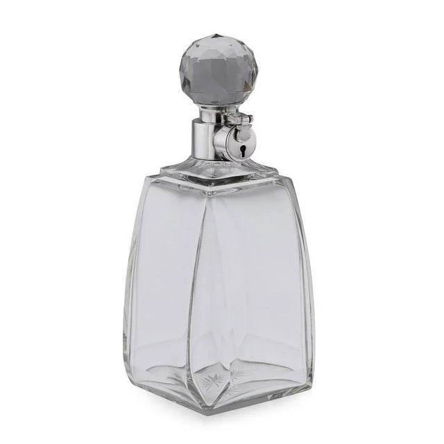 20th Century English Art Deco silver & glass spirit decanter. Of large size with glass body and mounted with elegant ball...