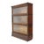 An antique Globe-Wernicke sectional barrister bookcase, crafted from quartered oak in the distinguished Arts & Crafts...
