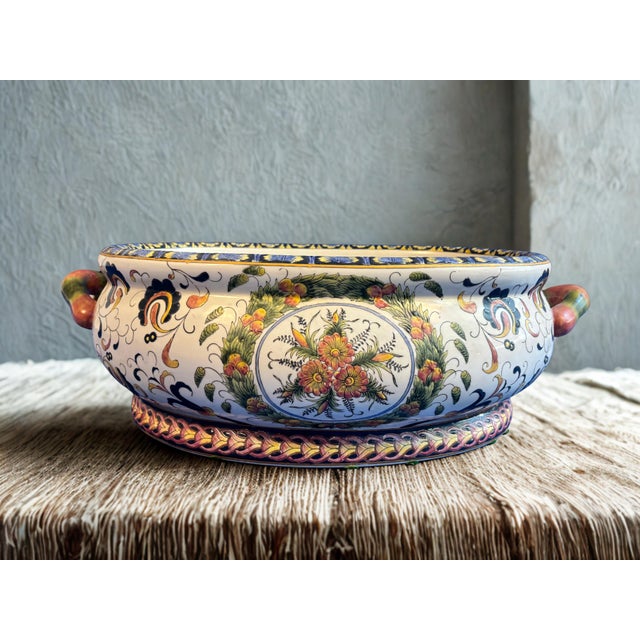 This vintage Chinoiserie porcelain bowl is hand painted and features exquisite artisan decoration with rich floral motifs,...